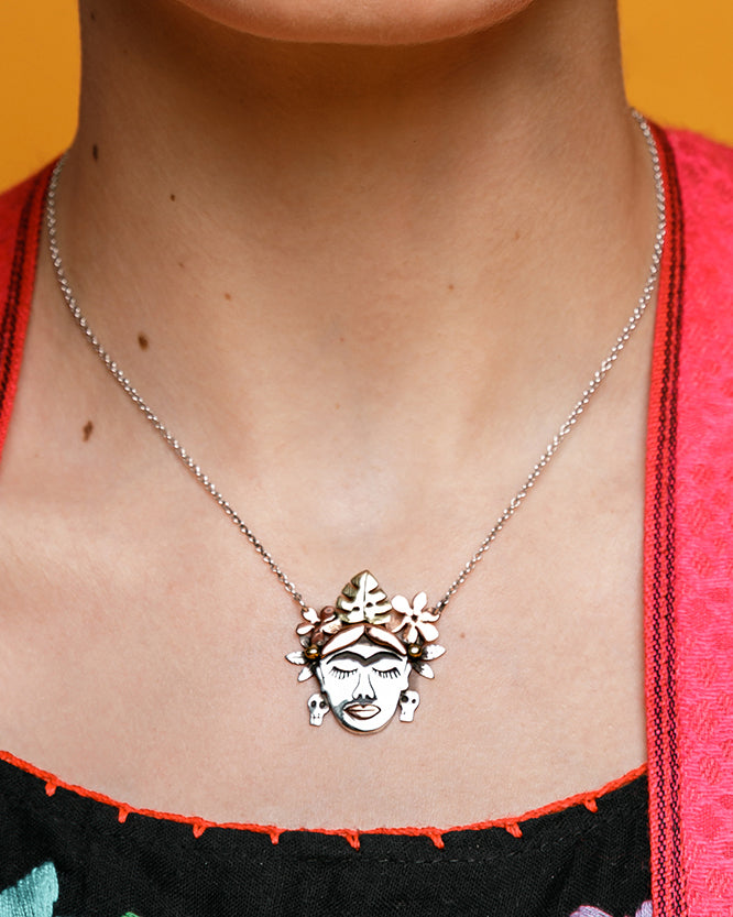 Frida Kahlo pendant made from Sterling Silver, Brass and Copper with a Sterling Silver chain. Some parts of the Sterling Silver is oxidised. 