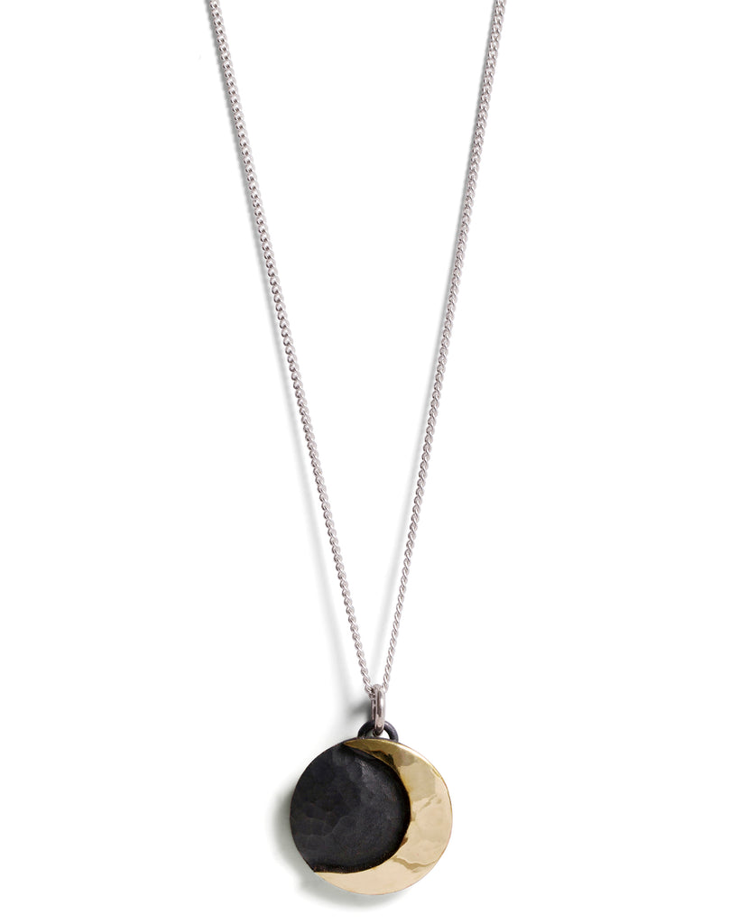 Fine Sterling Silver Curb Chain with link attached to Crescent Moon pendant that is oxidised and Brass Moon 