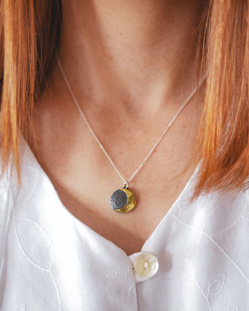 Fine Sterling Silver Curb Chain with link attached to Crescent Moon pendant that is oxidised and Brass Moon 