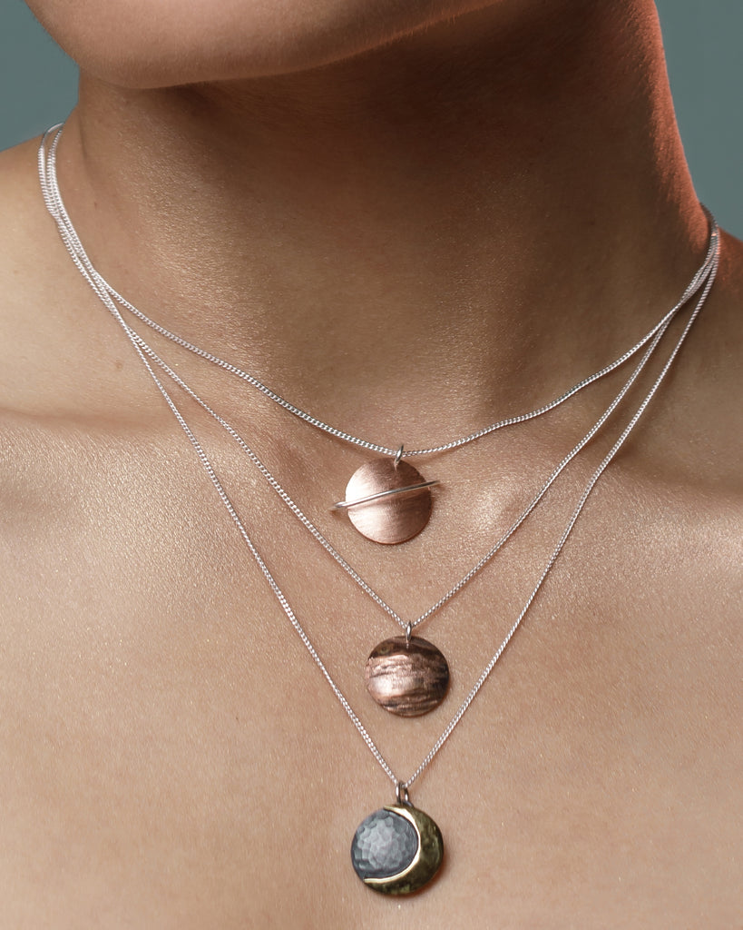 Fine Curb chain in sterling silver with a Copper Saturn, Copper Jupiter and Sterling silver and Brass Crescent Moon pendant 